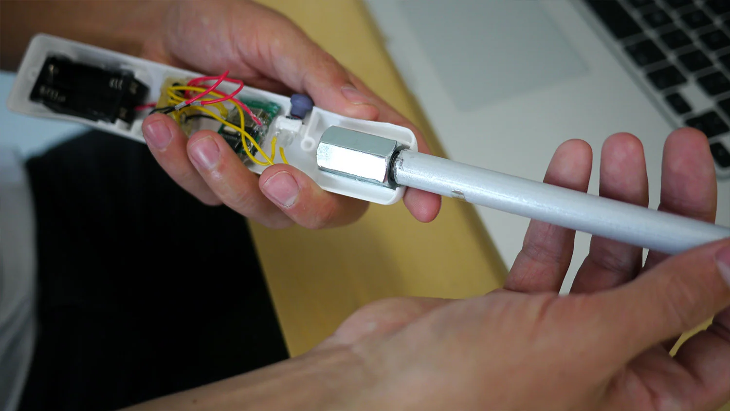 An opened grip showing its internal electronics